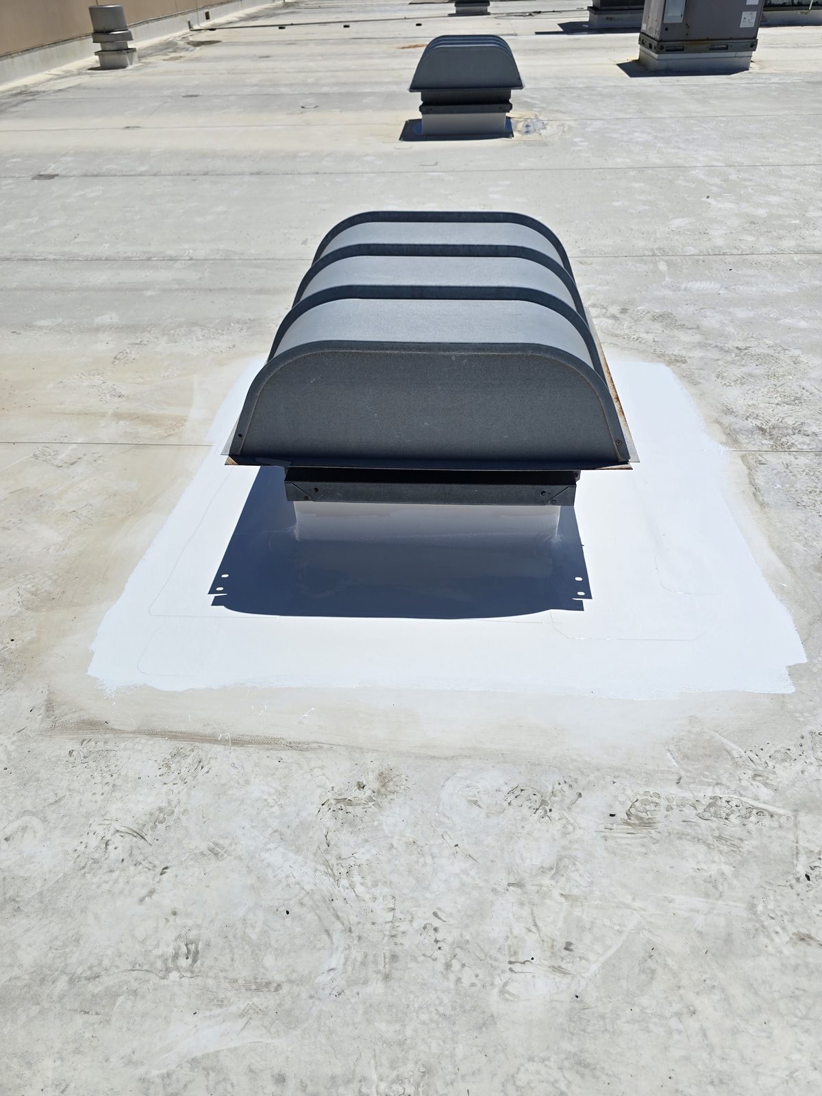 Roof vent curb sealed and coated where the penetration meets the roof surface